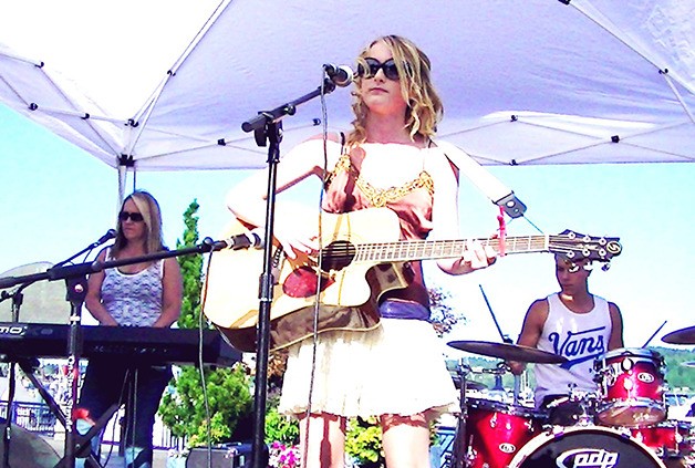 Afton Prater performs with friends during the Rock the Dock last Friday. Music is being played on the boardwalk in Bremerton every Friday throughout the summer.