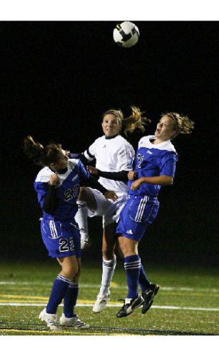 Lady vikings defender Georgia Suter heads a ball during Thursday’s home game against Olympic. The Vikes won the contest