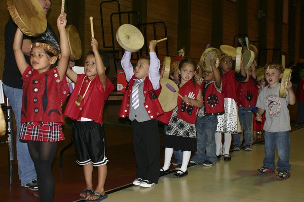 S’Klallam Head Start children participate in a song to welcome guests to their graduation Wednesday.