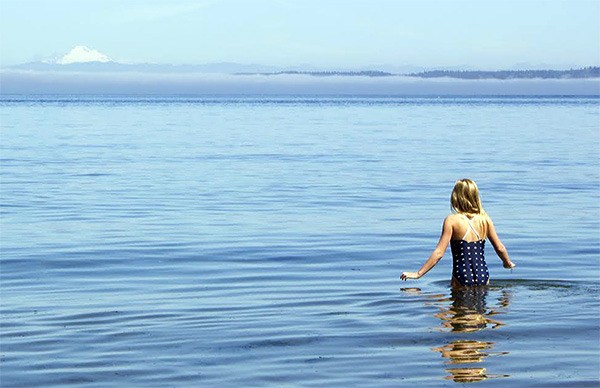 Lena Bowen heads out into the sea for a dunk on day 360 of her goal.