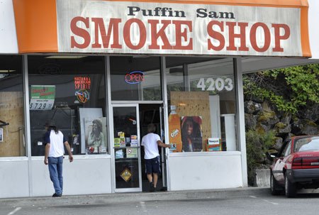 Customers enter Puffin Sam Smoke Shop on the 4200 block of Kitsap Way Wednesday. The smoke shop is one of the many local retail outlets for synthetic canibis now sold as incense.