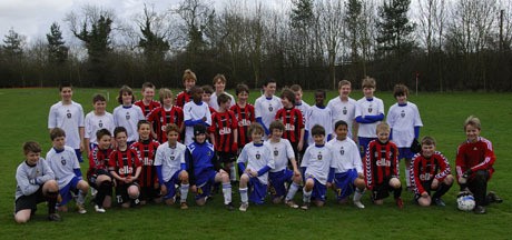 Players from the North Kitsap Soccer Club's boys U-13 Comets team (in white) pose with their new friends from the Moretonville Rovers Football Club in Buckinghamshire