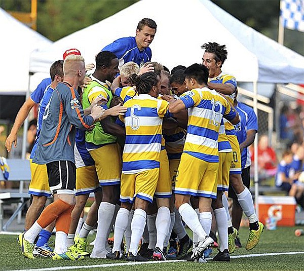 The Kitsap Pumas celebrating a goal during season. The Pumas went undefeated during regular season before being knocked out in the Western Conferences.