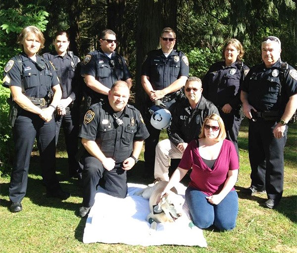 Port Orchard Police Department team members pose with Amber one last time.