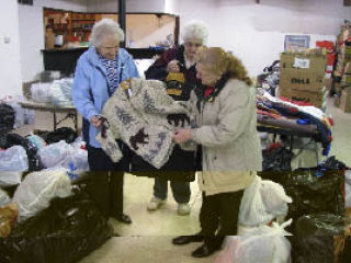 Volunteers sort donations for distribution at the stand down event on May 3.