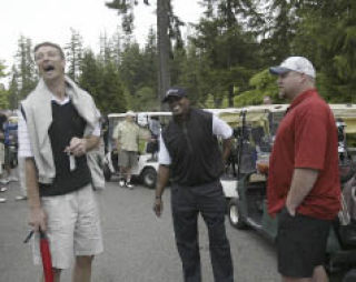 Former Sonic Detlef Schrempf (left) shares a laugh with NFLers Lawyer Milloy (center) and Benji Olson Monday.