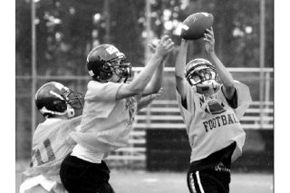 North Kitsap football team hopeful Jesse Vanden challenges for the ball during preseason turnouts this week. The opening game is at 7 p.m. Sept. 5 at NK Stadium against Bainbridge Island High.