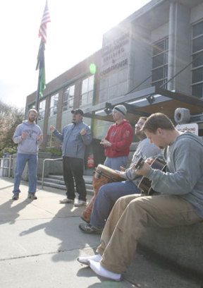 Members of the World Mission Bible Fellowship sang outside the Kitsap County Courthouse Wednesday to support members of The Church in South Colby while their pastor Robbin Harper was being sentenced.