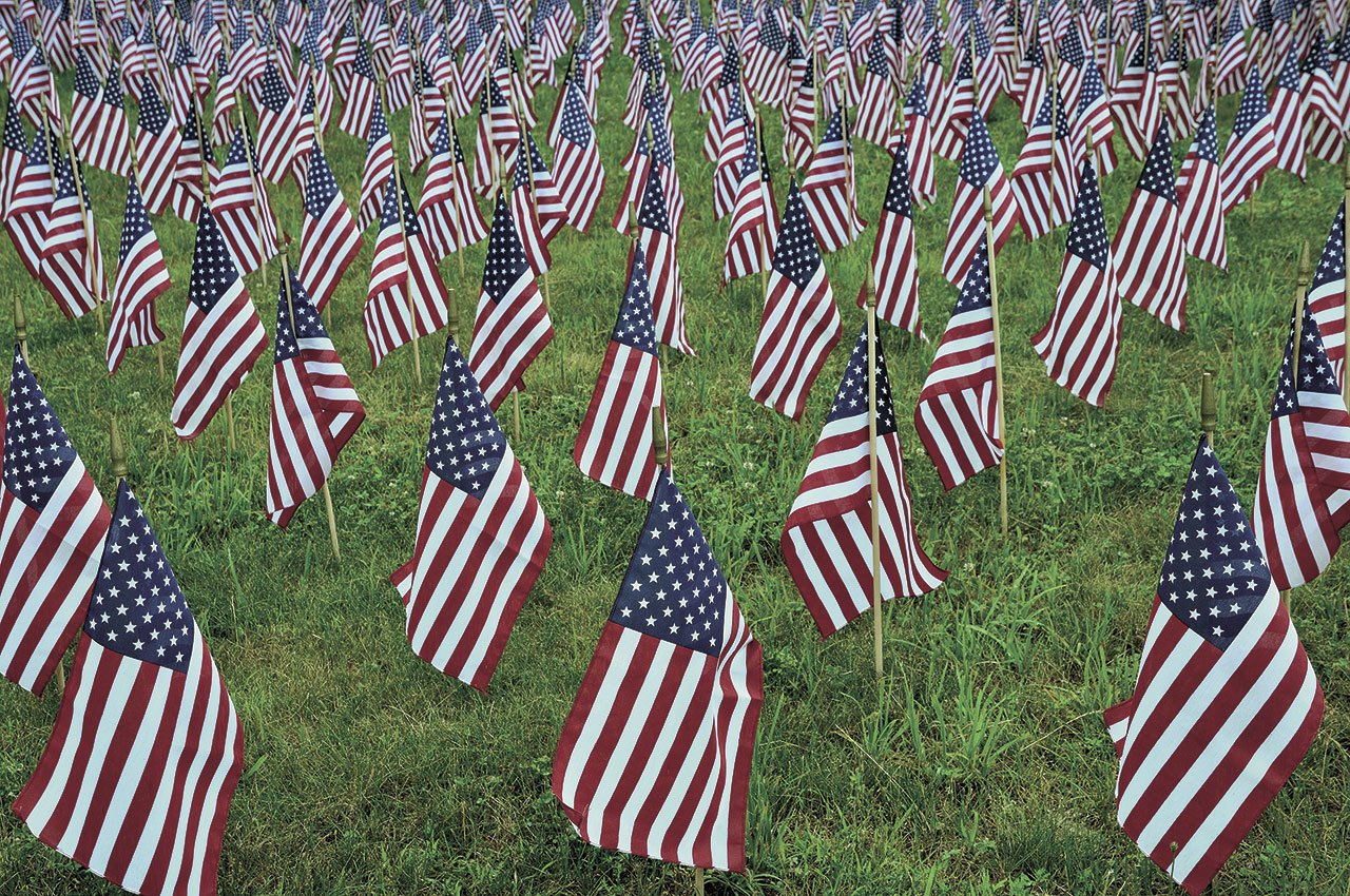 A field of flags for Veterans Day at Ivy Green Cemetery