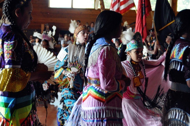 Tribal drummers lead the opening ceremonies on Saturday at the annual Chief Seattle Days in Suquamish. (Below) Grilled salmon was the featured dish at the annual celebration.