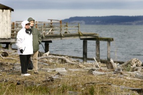 Mossen Habbestad (left) and Anne Hults walked the beachfront during Saturday's grand opening of Norwegian Point Park.