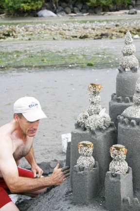 Indianola resident Jeff Daley works on the sand sculpture grand champion winner
