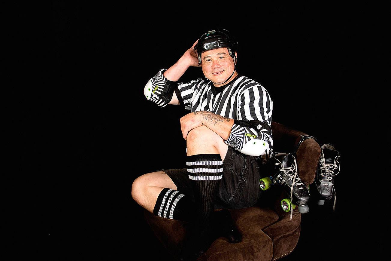 Bill Barnum, a roller derby referee, poses with roller derby gear for Elaine Turso’s Dudes Against Human Trafficking calendar, available for puchase at elainetursophotography.com. When Barnum applied to participate in the calendar, he said, “As a past member of BACA (Bikers Against Child Abuse), I have seen the impact that any abuse against another human being can have. As a parent of a special child, my wife and I know firsthand what damage can mean long term to a child.”                                Elaine Turso Photography