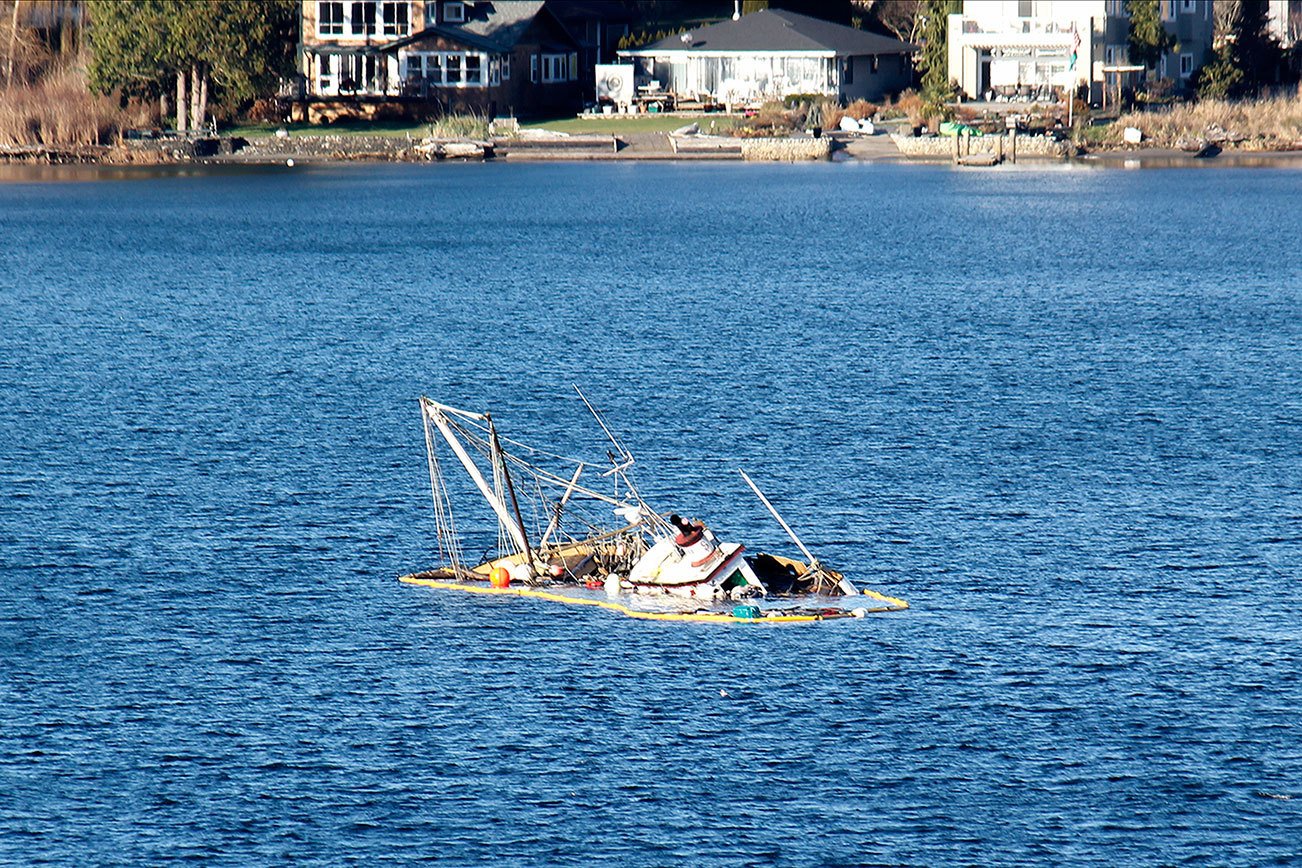 Approximately 250 gallons of fuel were removed Dec. 12 from a vessel that broke away from its anchor chain, drifted ashore and beached in Apple Tree Cove. (Sophie Bonomi / Kitsap Daily News)