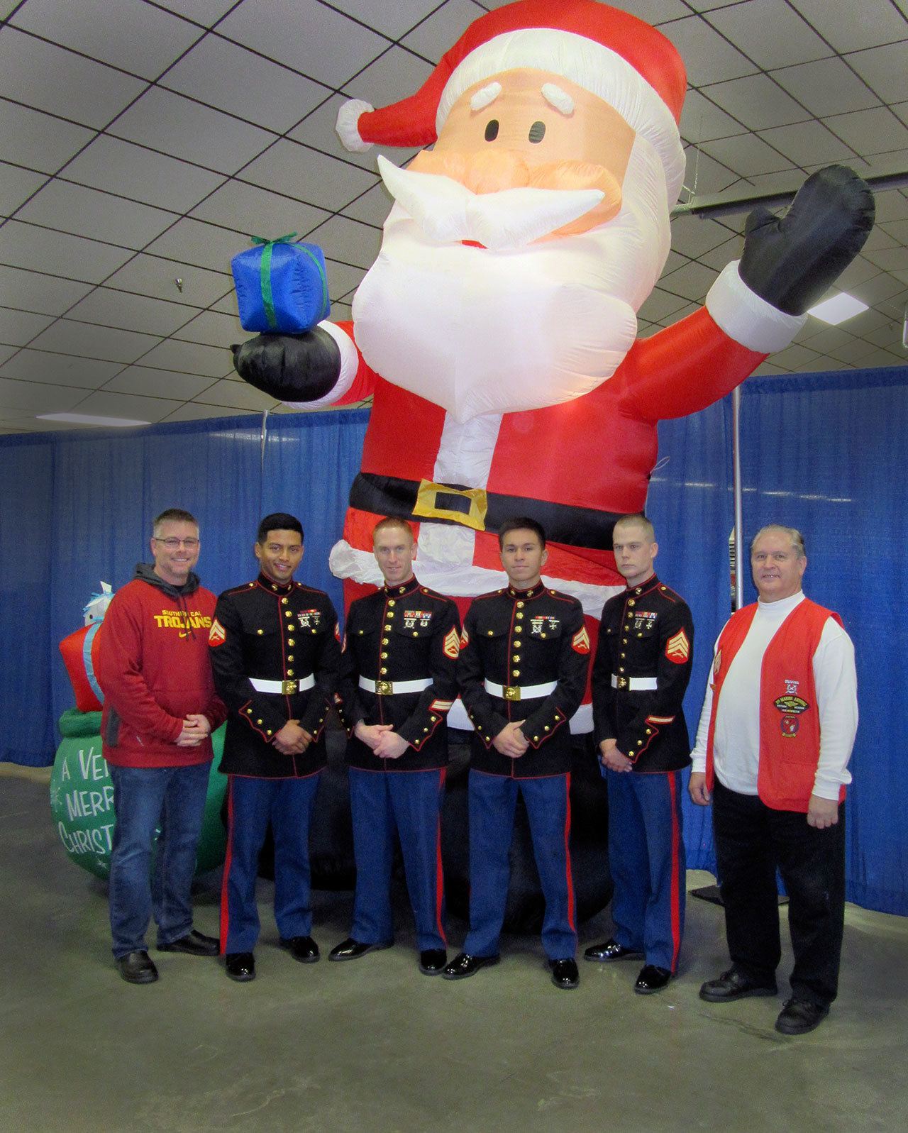 Volunteering with Toys for Tots in Kitsap County: from left, MSgt. Jason Selby (ret.), Cpl. Jairo Garcia, SSgt. Nate Gilbert, Cpl. Abran Baramila, Sgt. Joshua Rowell, and Sgt. Vince Smith (ret.).                                Terryl Asla/                                Kitsap News Group