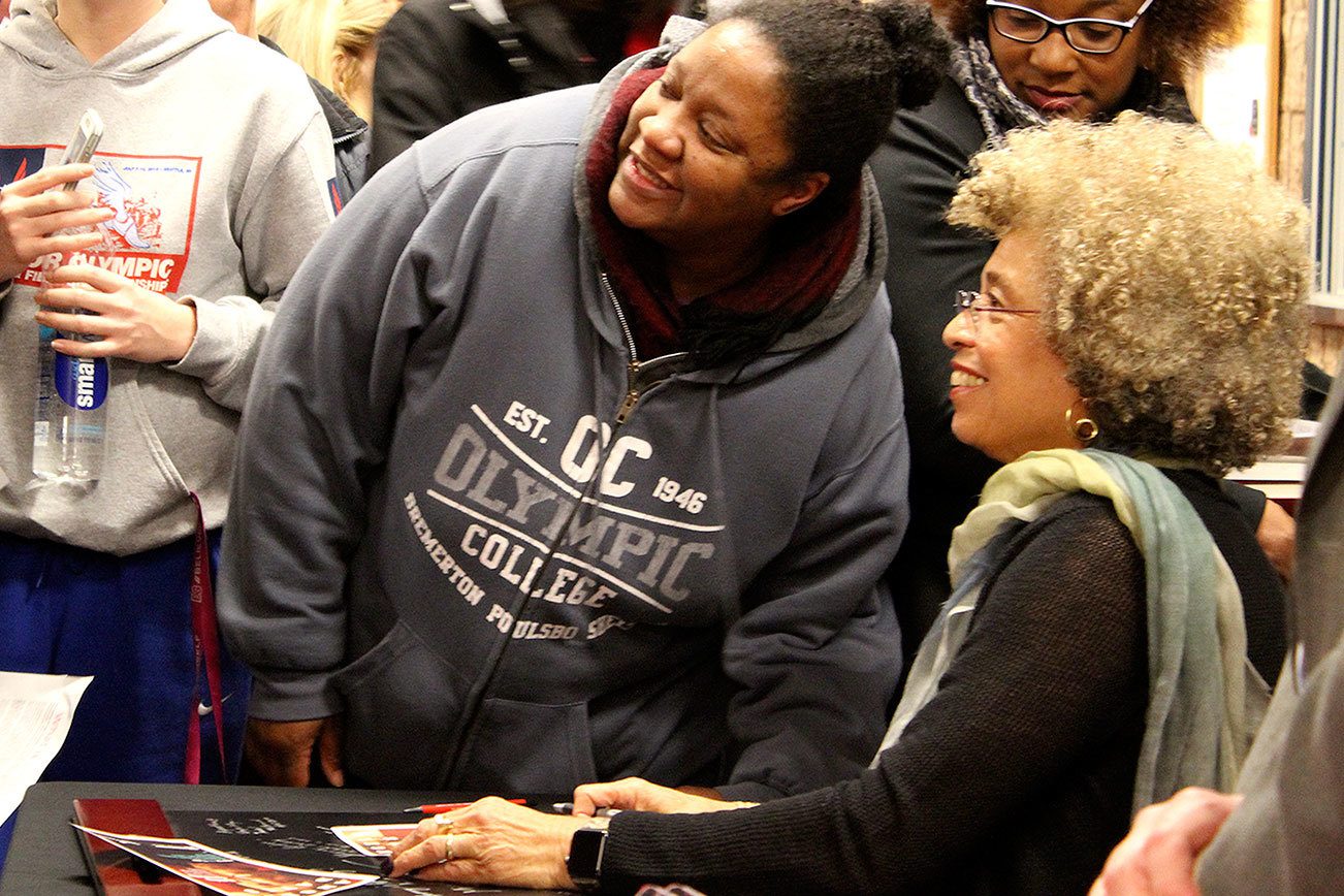 After her lecture on educational equity, Angela Davis signed books and had her photo taken with audience members. Michelle Beahm / Kitsap News Group