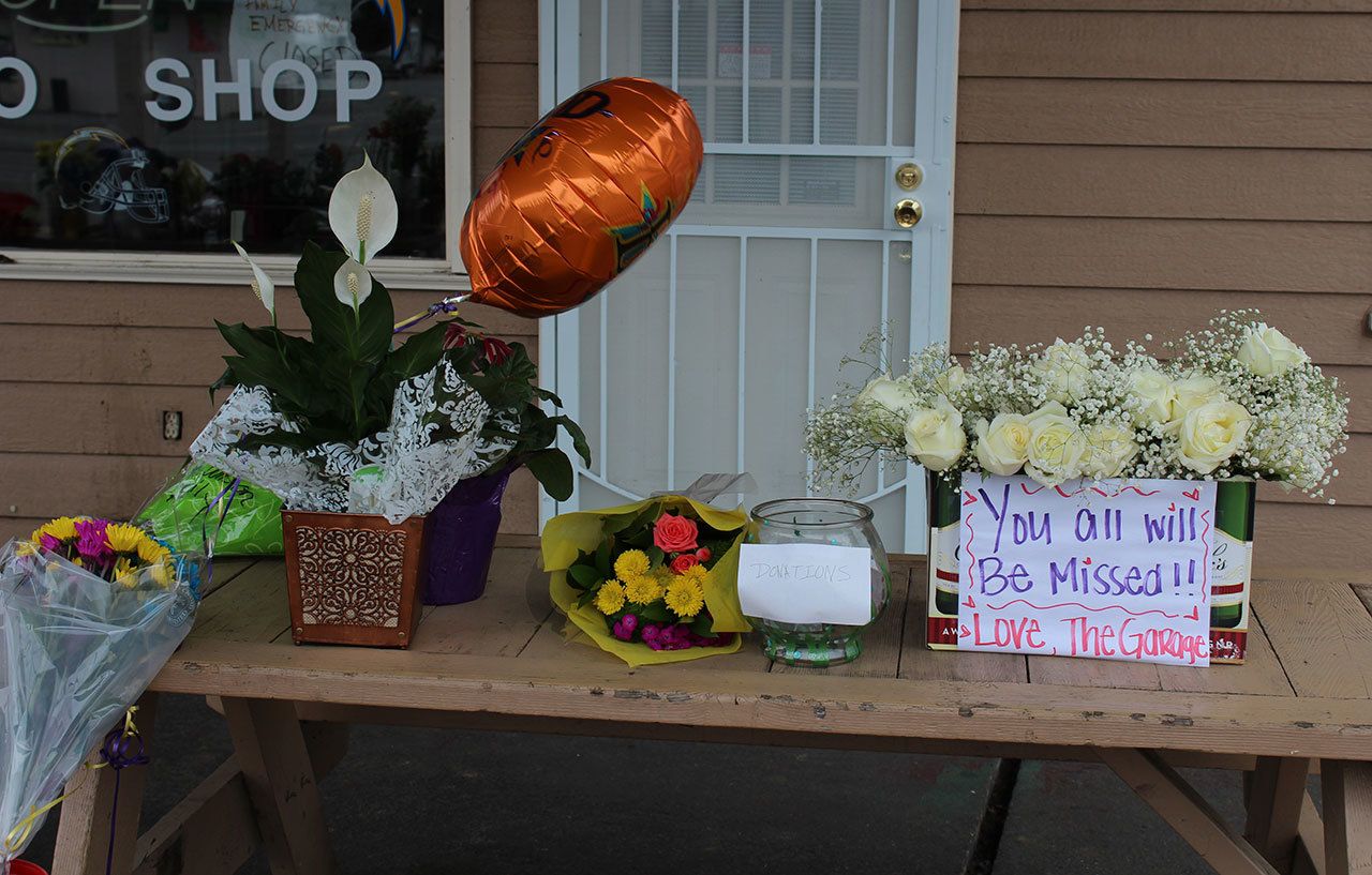 Mourners left flowers, balloons and messages on the table outside Juanito’s Taco Shop on Kitsap Way. The taco shop, which was closed Jan. 30, is associated with some of the people who died in the apparent triple-homicide in Seabeck on Jan. 27. Michelle Beahm / Kitsap News Group