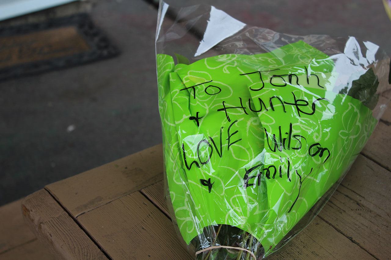 Mourners left flowers, balloons and messages on the table outside Juanito’s Taco Shop on Kitsap Way. The taco shop, which was closed Jan. 30, is associated with some of the people who died in the apparent triple-homicide in Seabeck on Jan. 27. Michelle Beahm / Kitsap News Group