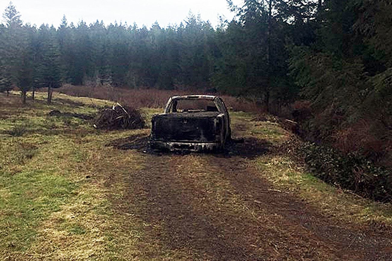 Human remains were found in this burned truck in a forested area of Mason County. The truck originated at a Seabeck house where a triple homicide occurred. Photo: Kitsap County Sheriff’s Department