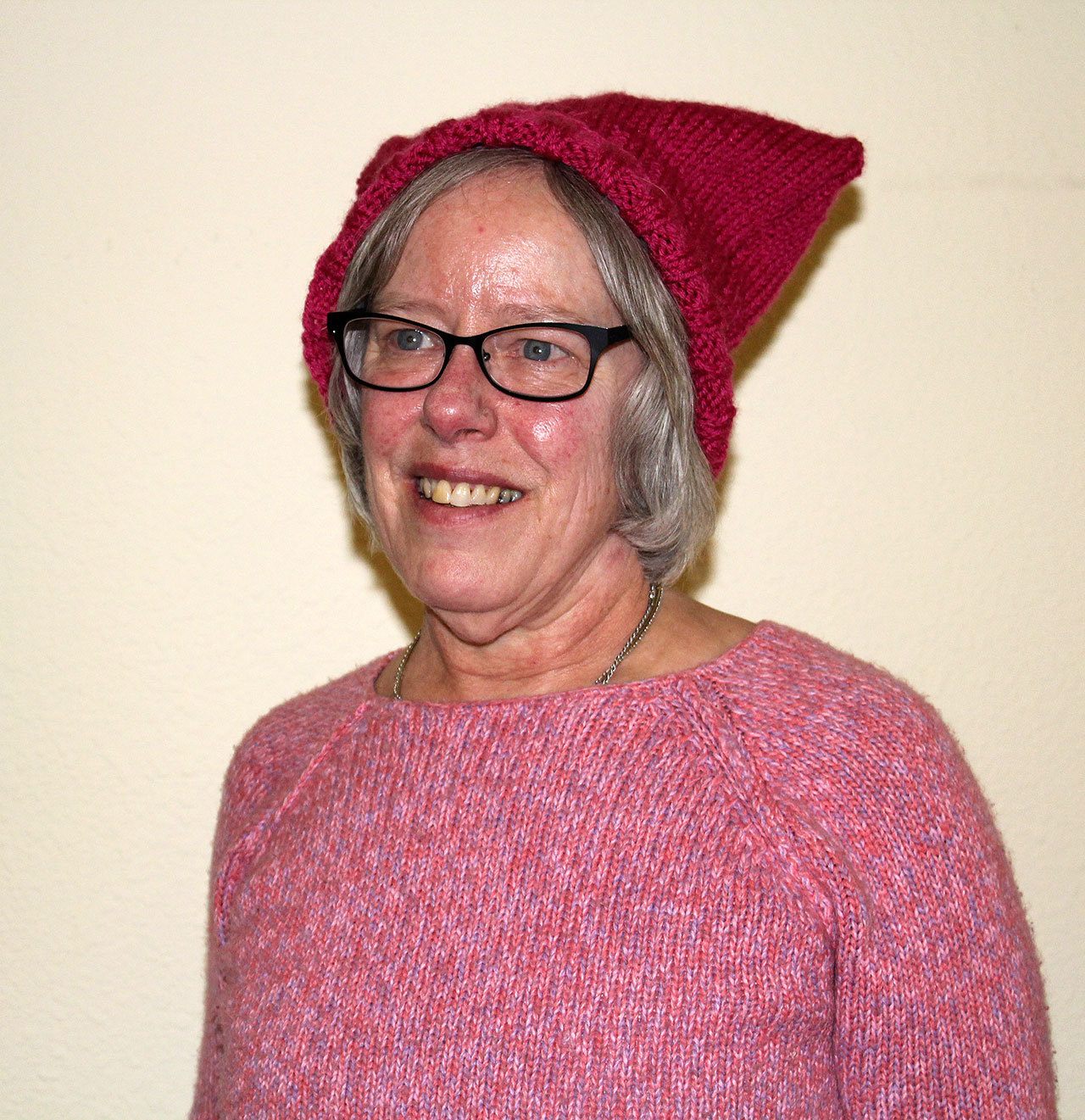 Kay Daling, 66, of Silverdale, still wears the pink “pussy” hat she made for the Women’s March in Washington D.C. as a reminder. “I don’t want to do one thing and let it drop,” she said. “I feel like I have an obligation, if I care, tocontinue it. And it’s one way for me to say, I still stand for this.”                                Michelle Beahm / Kitsap News Group