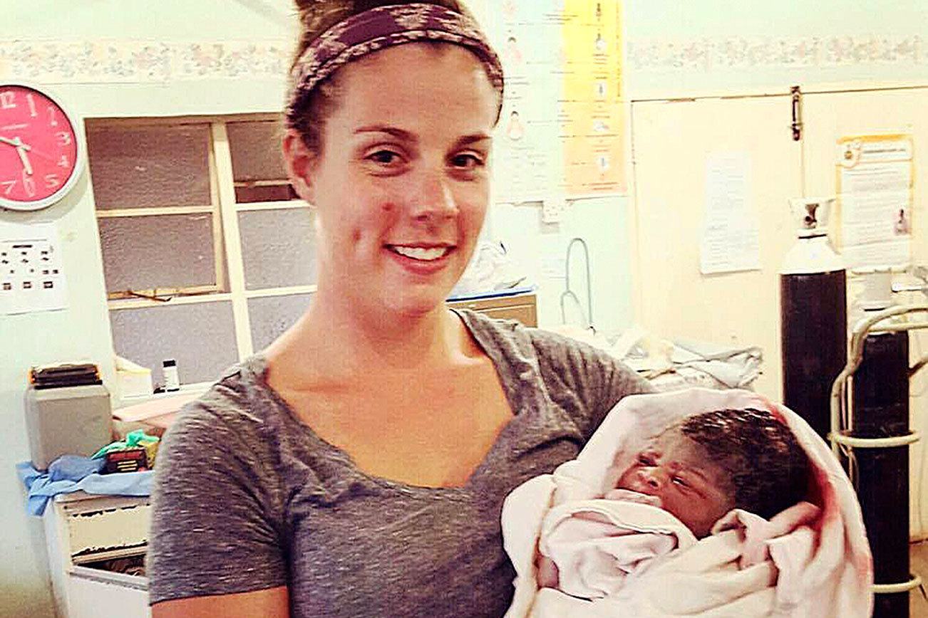 Ellen Yates Barnard with the baby of someone for whom she was a doula, while Barnard was volunteering at a birthing center for a month in Zimbabwe in Africa.                                Photo courtesy Ellen Yates Barnard