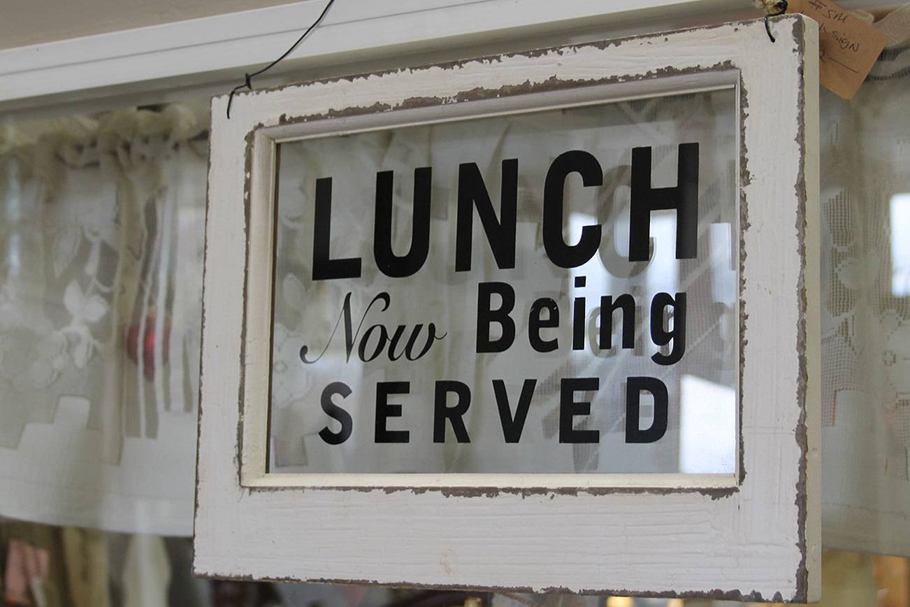 Antique, vintage and retro objects are increasingly in vogue because they help tell our story. And, some stuff, like this window sign at Re-Noun on Viking Avenue in Poulsbo, is just really cool. (Richard Walker/Kitsap News Group)