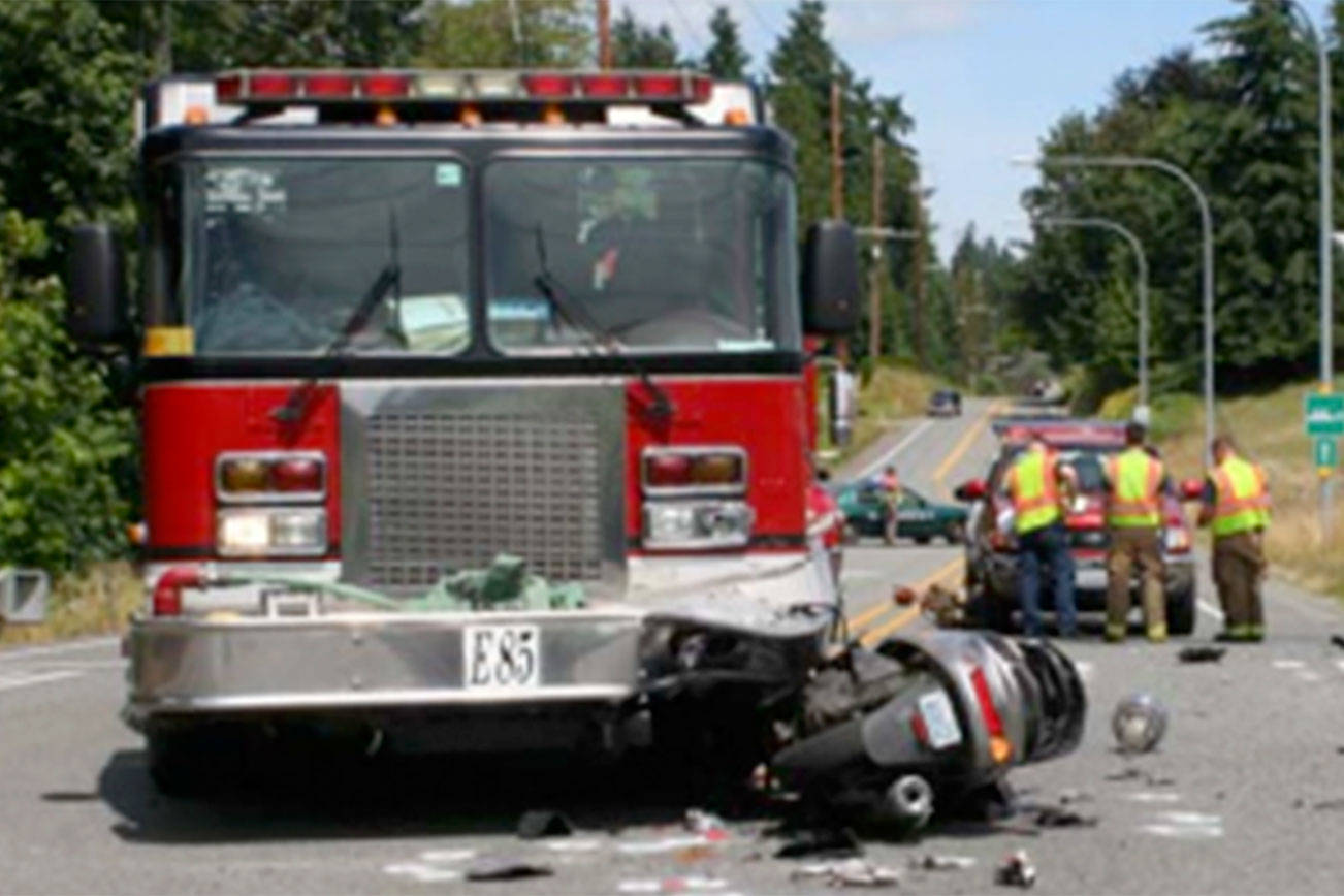 The scene of the fatal crash between a NKF&R fire truck and a Yamaha scooter, July 4, 2014, in Kingston. File photo