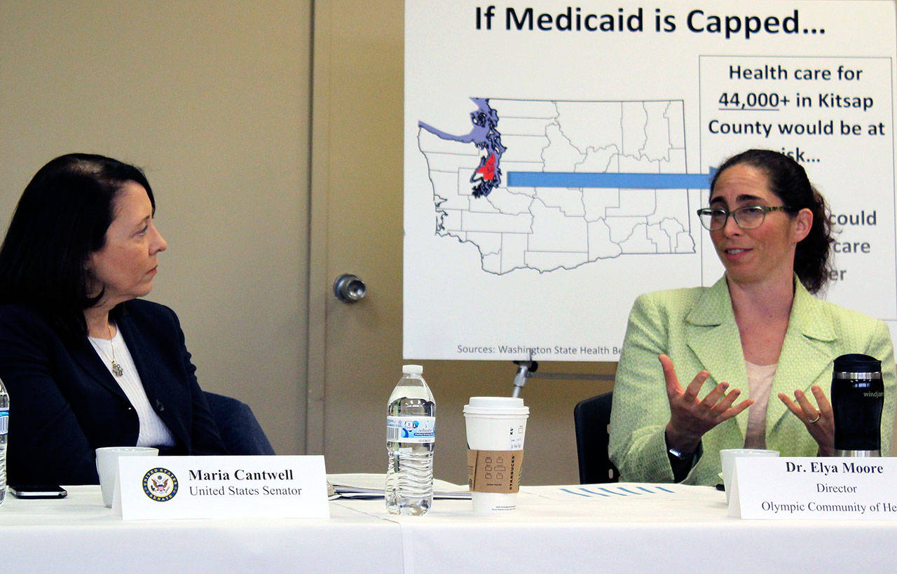 At left, U.S. Sen. Maria Cantwell, D-Washington, listens to Elya Moore, director of Olympic Community of Health, talk about the collaborative and cooperative efforts taking place in Kitsap County.Terryl Asla/Kitsap News Group