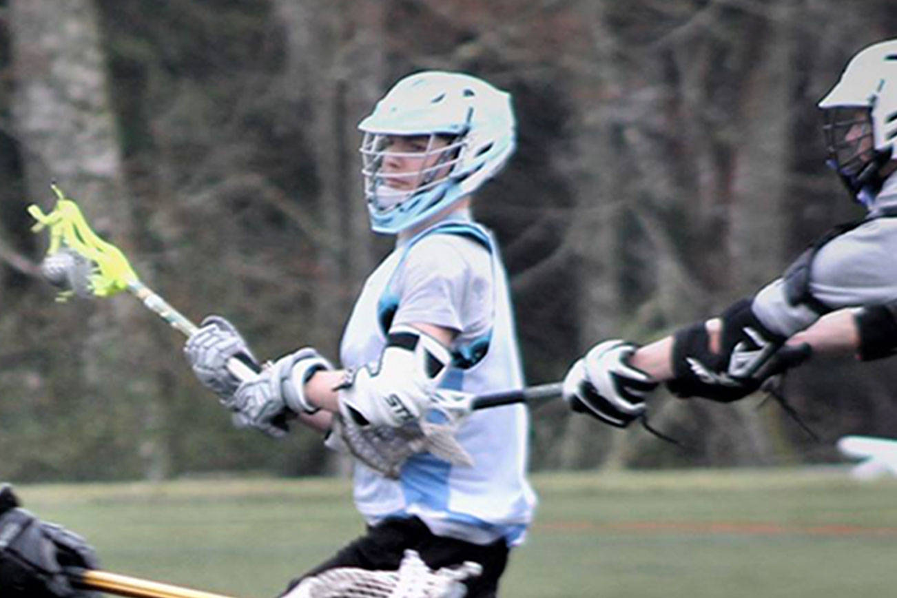 Logan Cole scored the winning goal for North Kitsap lacrosse in the team’s 12-11 overtimewin over Klahowya, March 27 at Strawberry Field. (Richard Walker/Kitsap News Group)