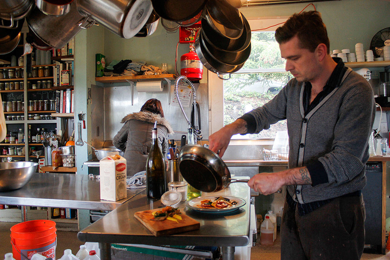 Chefs John Delp and Pam Buitenveld work in the Mossback kitchen. (Sophie Bonomi / Kitsap News Group)