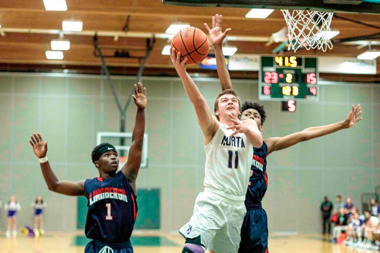 Viking sophomore Cooper Lindsey goes for the shot in the Vikings game against Lindbergh Feb. 15. (Harry McConnell / Contributed)