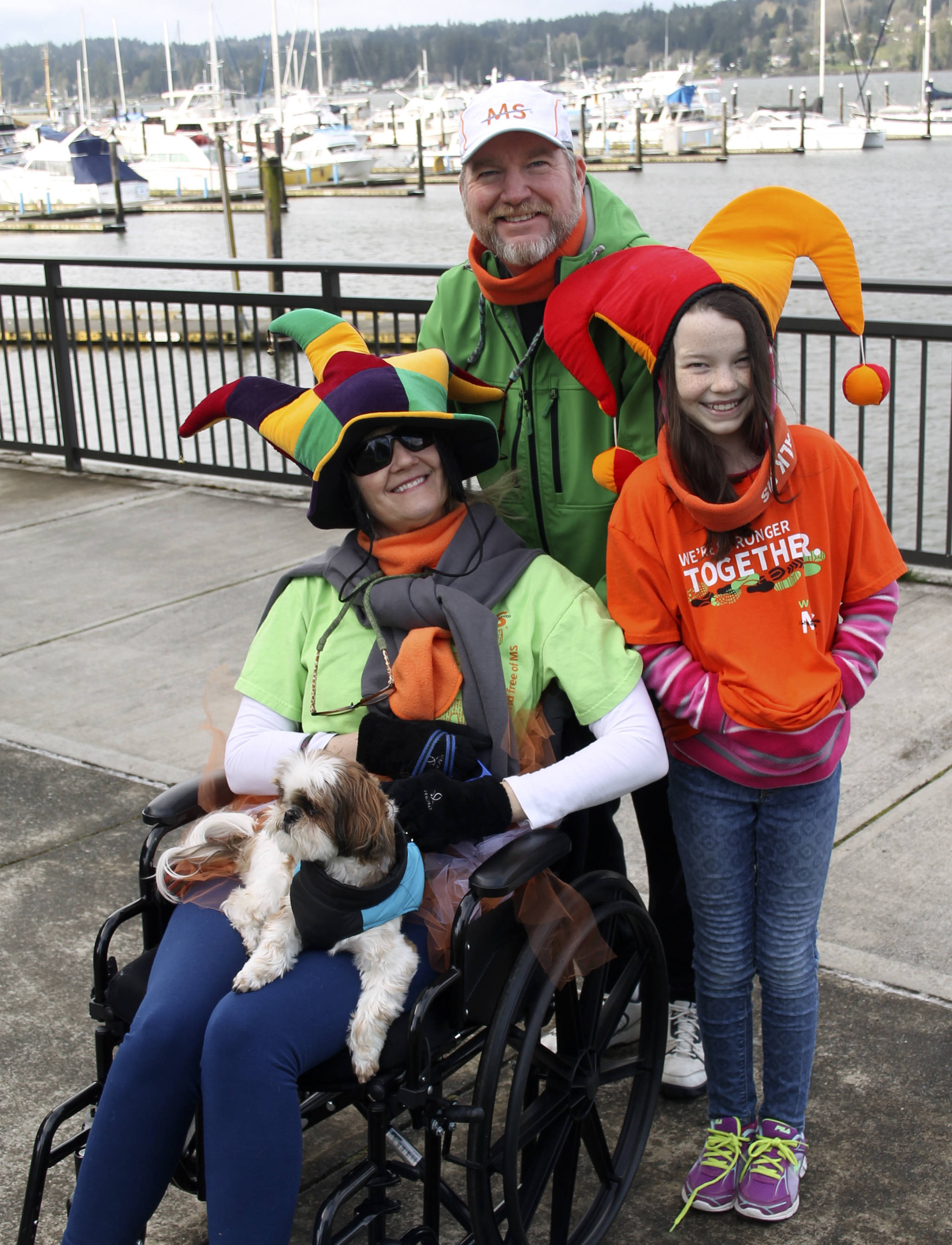 The Plake family wasn’t clowning around about fighting MS, but they kept their sense of humor. Jennifer (left), who was diagnosed with MS five years ago, brought along her husband John, daughter Jennifer and Indy the dog. (Terryl Asla/Kitsap News Group)