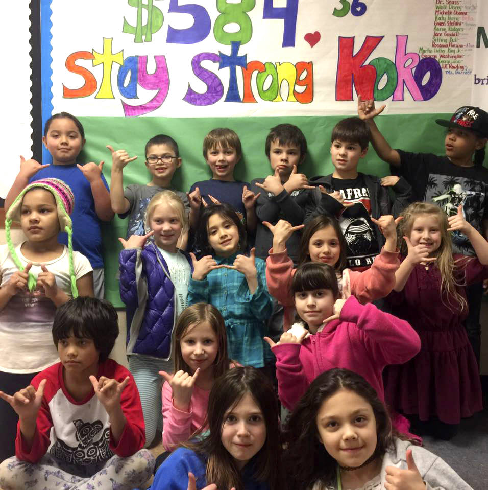 Students in Rebecca Garrett’s second-grade class “hang loose” as they raise money for their peer, Koko, during their month-long lesson on empathy. Rebecca Garrett/Contributed