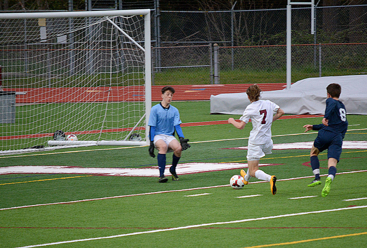 Grant Larson scoring the third and final goal in the Wolves win of the Eagles.
