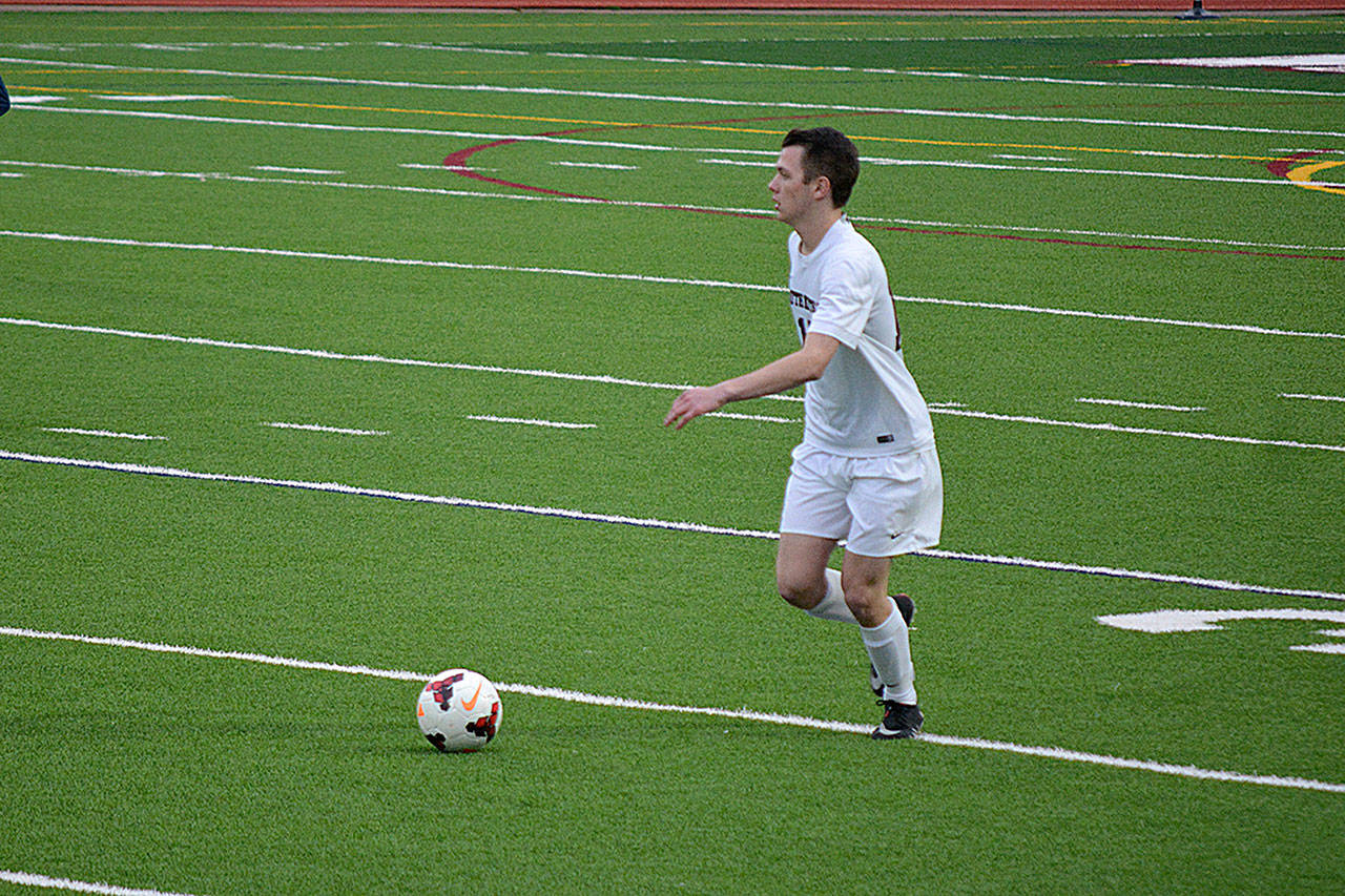Defender Jackson Kambich collecting a ball in the back to take it up field.