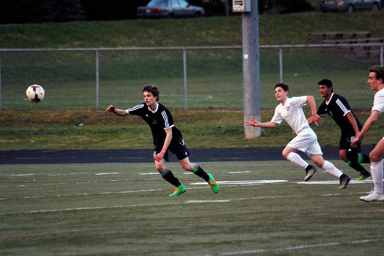 Klahowya and North Kitsap players race for possession March 30. The game ended in a 1-1 tie. Sophie Bonomi/Kitsap News Group