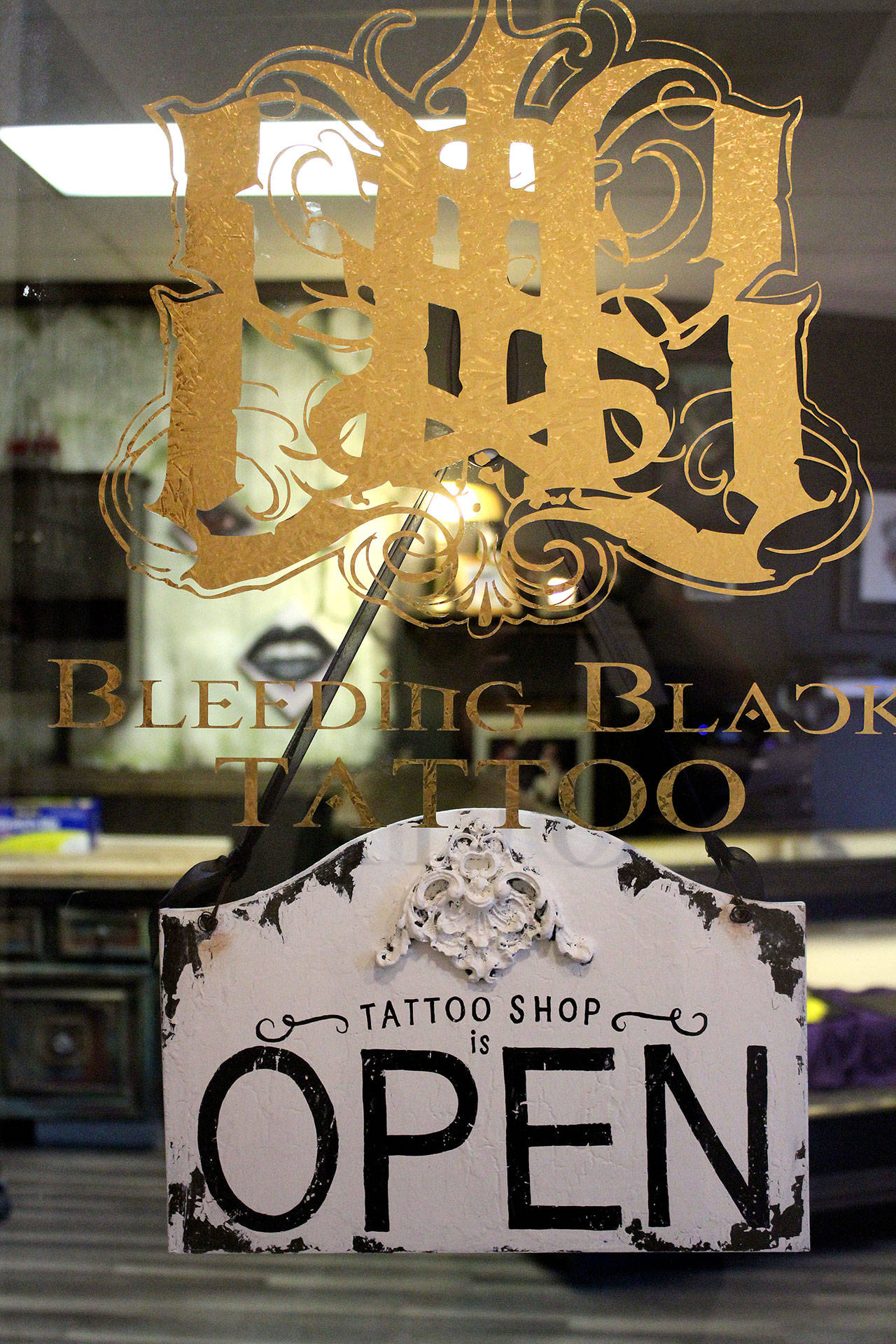 Bleeding Black Tattoo, owned by artist Nik Flores, is open 11 a.m. to 9 p.m. daily in Old Town Silverdale. Bleeding Black specializes in custom tattoos of any style.                                Michelle Beahm / Kitsap News Group