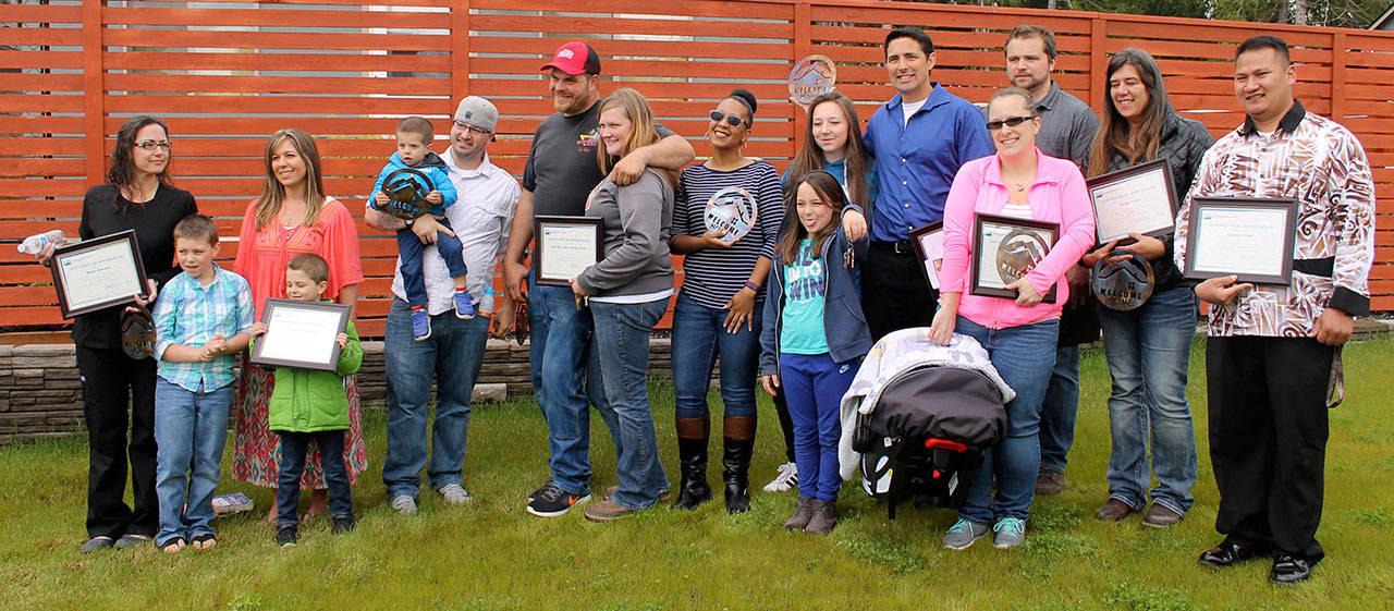 From left: Marika Berensen; Hollie and Charles Mitchell with three sons; Cody Wells and Catherine Jenson; Garnet Finister; Jason Irvine and two daughters; Elena Hurtt and two-day-old baby; Sean Wright;Tiffany Yeadon; and Saneriva Fuiava. Asla/Kitsap News Group