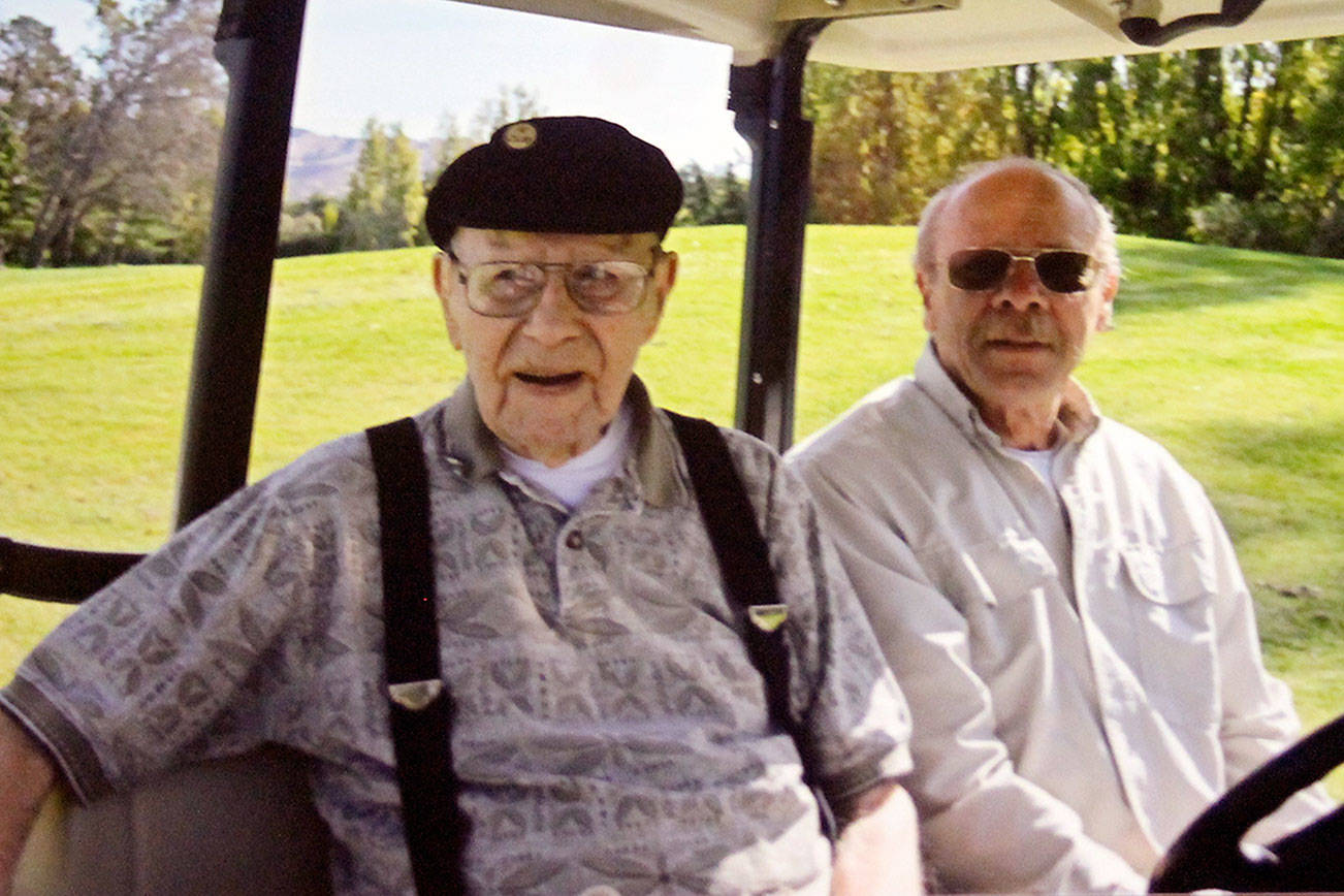 Dan Wenzlaff of Poulsbo and his son, Bob, head to the green at a golf course in Napa, California, in November 2016. The elder Wenzlaff was 103. (Wenzlaff family photo)