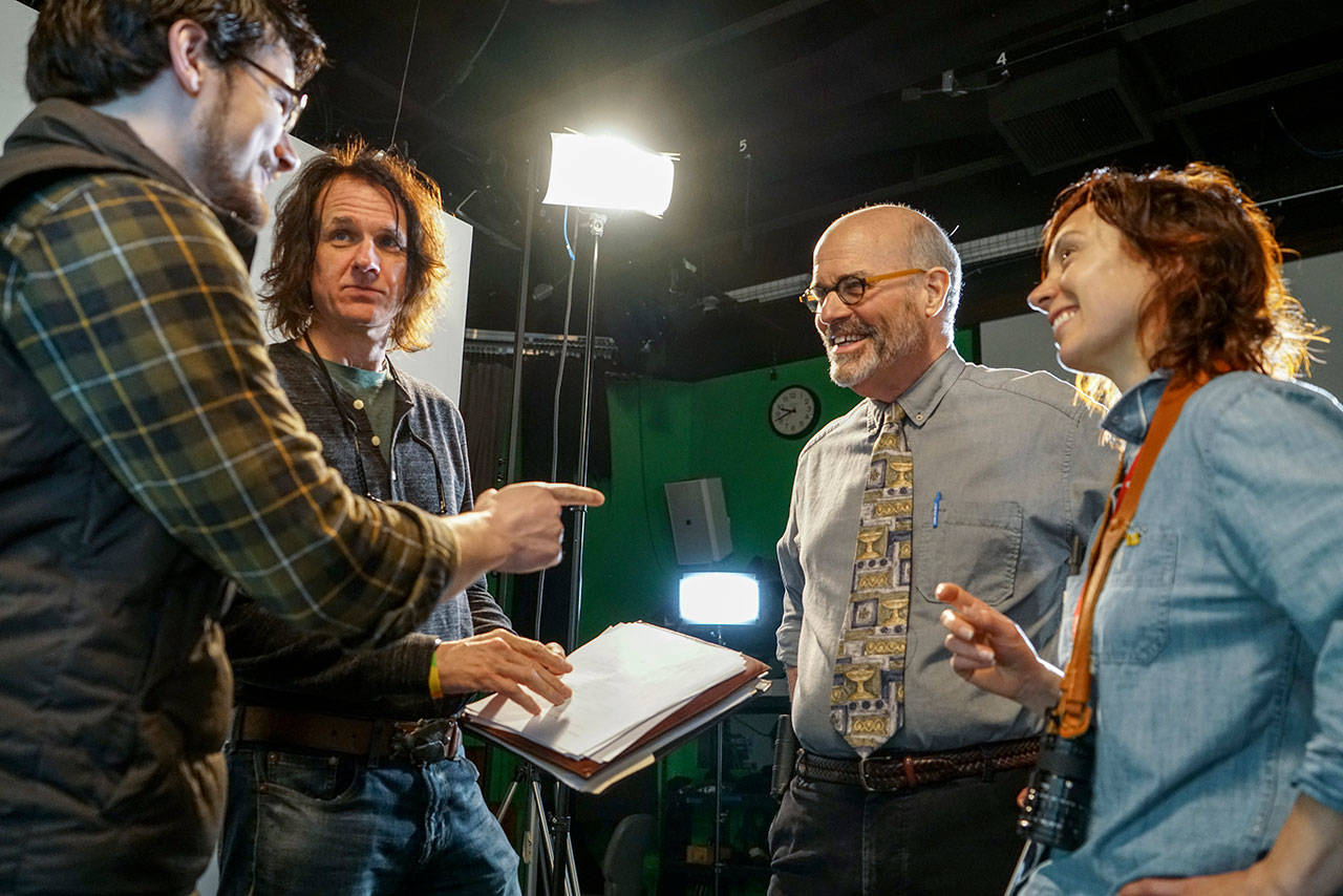 Faculty members discuss a scene with a student. From right, Amy Hesketh, professor of digital film making; Timothy Hagan, founder and director of the OC Film School; and Aaron Drane, professor of screenwriting.                                Olympic College/Contributed