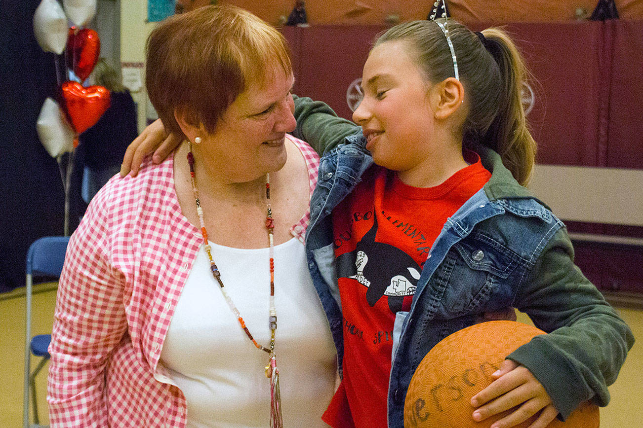 Poulsbo Elementary School Principal Claudia Alves is retiring after 46 years as a educator. Students a, faculty and staff members honored her in a full-house assembly June 16 at the school. (Sophie Bonomi/Kitsap News Group)