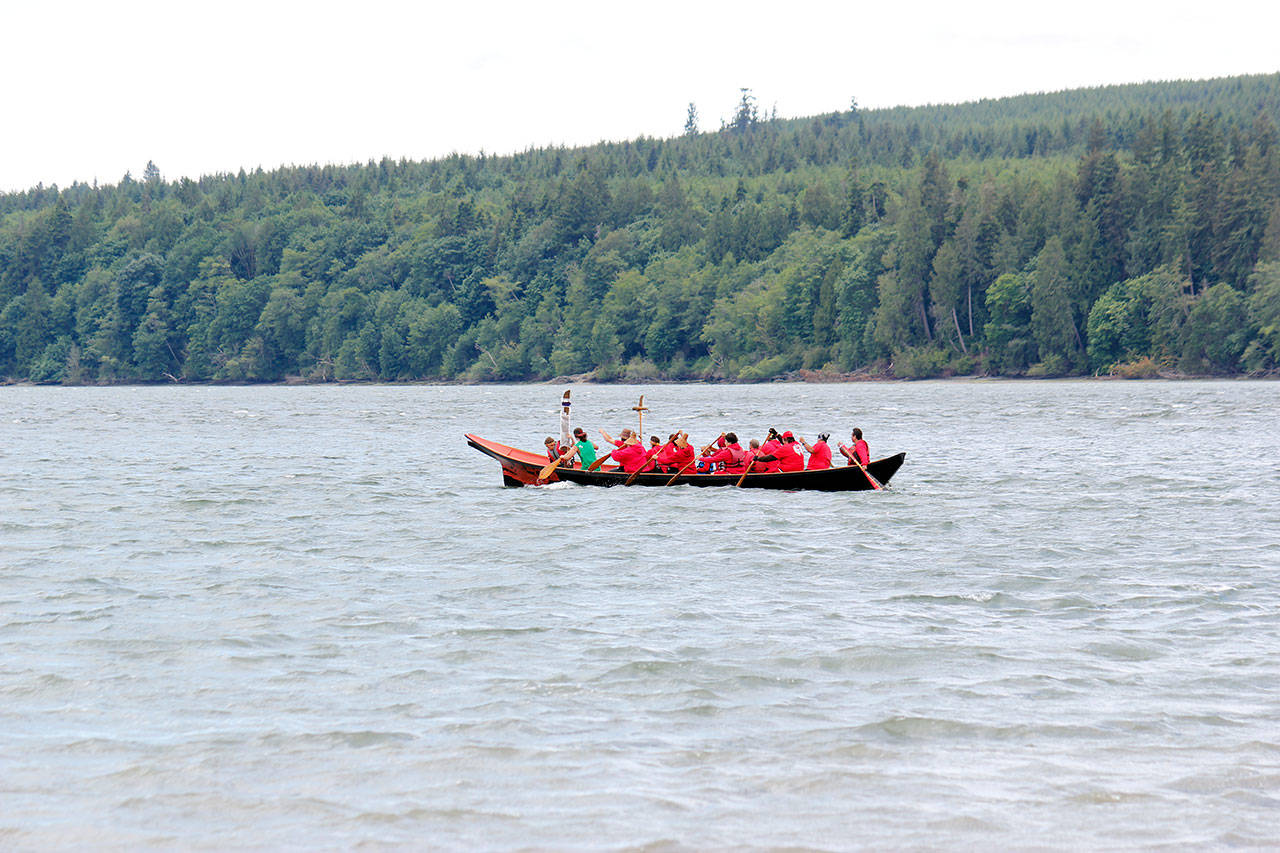 The Port Gamble S’Klallam canoe family travels from Point Julia to the former site of the Port Gamble mill, June 8. (Sophie Bonomi/Kitsap News Group)