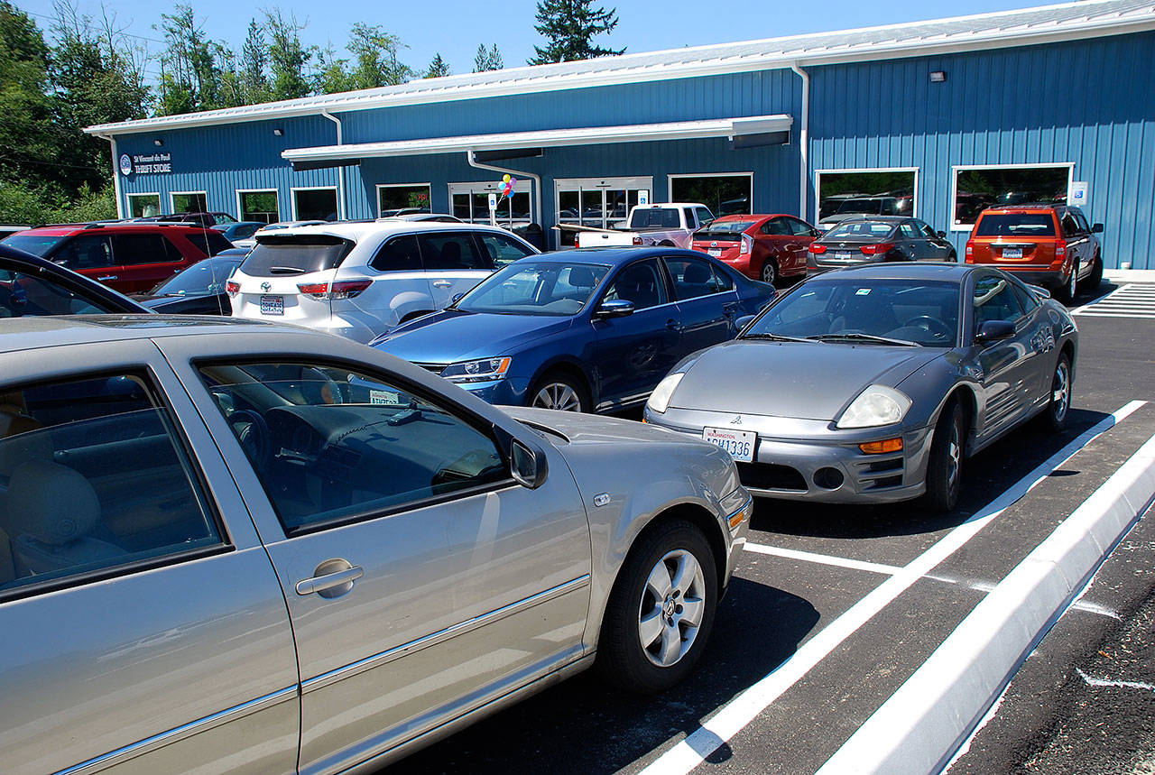 St. Vincent de Paul’s parking lot quickly filled following a posting on the organization’s Facebook page that its new building was finally open. Photo: Bob Smith | Kitsap Daily News