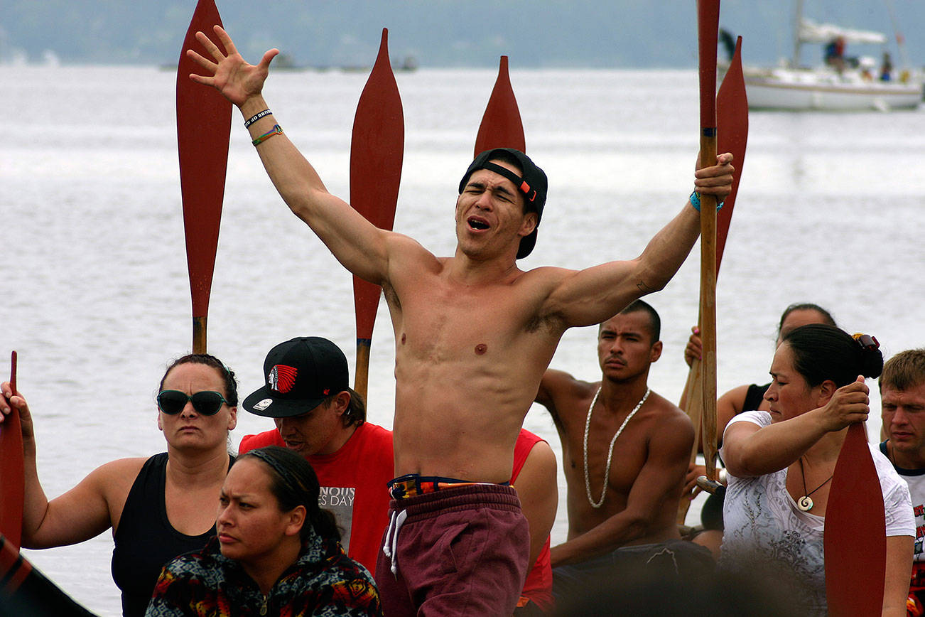 A prayerful DeShawn Joseph, in the Tulalip Tribes’ Big Brother canoe, at Point Julia during the 2013 Canoe Journey/Paddle to Quinault. (Richard Walker/2013)