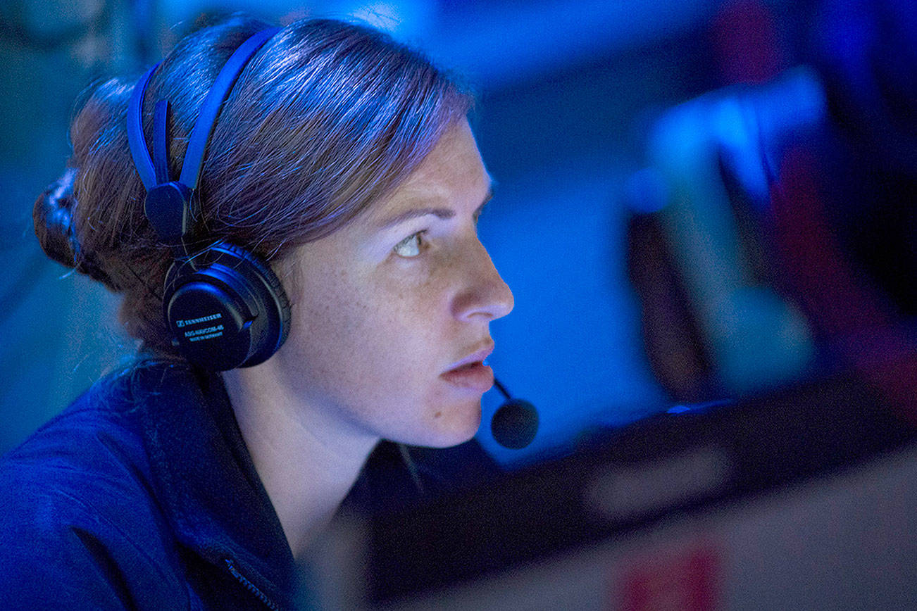 Navy Lt. Megan Ricker of Bremerton makes a report on July 17 during an air defense exercise aboard the guided-missile destroyer USS Sterett (DDG 104). USS Sterett is participating in Talisman Saber 17, an exercise intended to flex the “Up-Gunned Expeditionary Strike Group (ESG)” concept, using cruiser and destroyer assets to protect the ESG against air threats. Talisman Saber is a biennial U.S.-Australia bilateral exercise held off the coast of Australia meant to achieve interoperability and strengthen the U.S.-Australia alliance.                                (Mass Communication Specialist 1st Class Byron C. Linder/U.S. Navy)