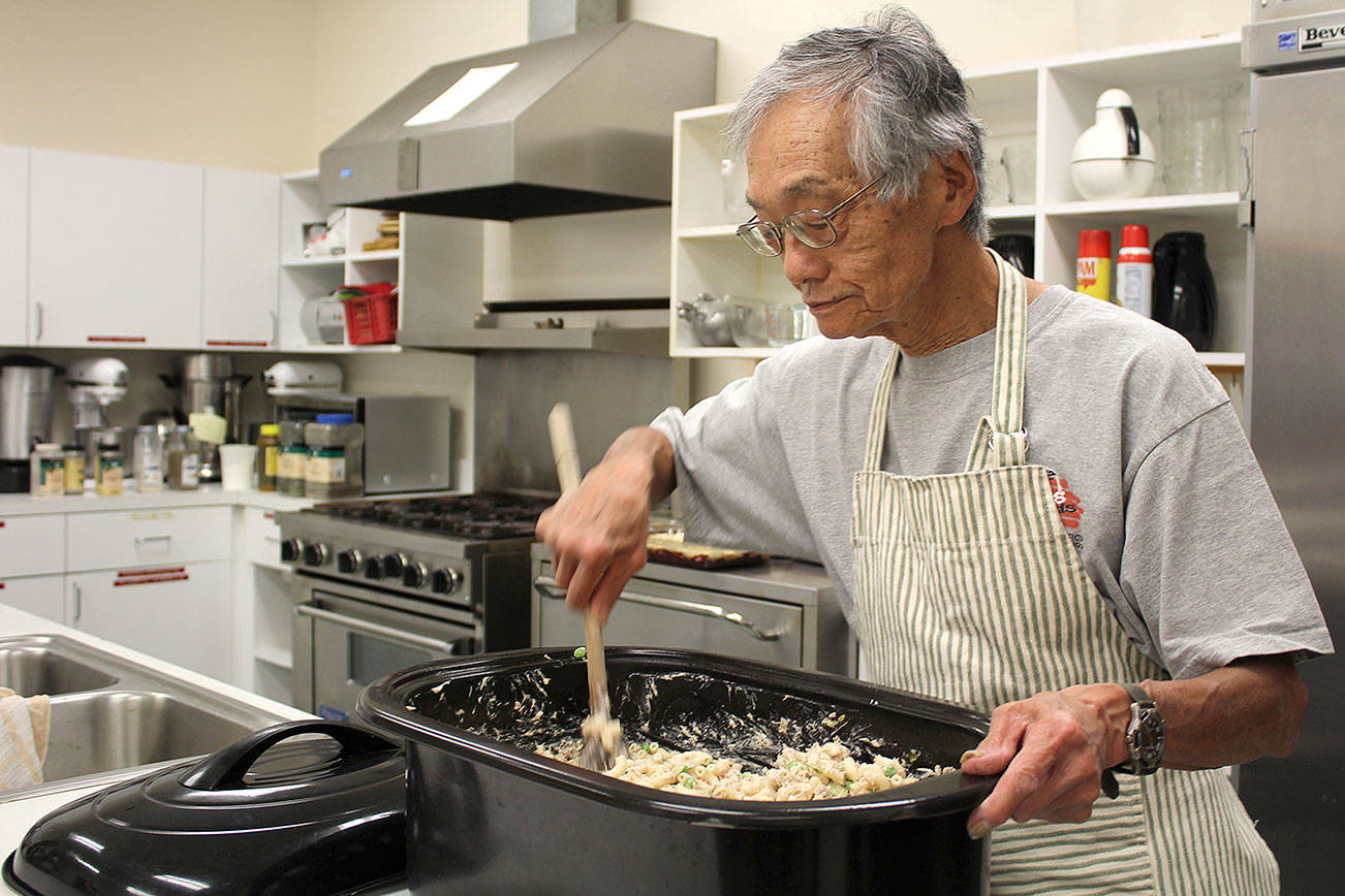 Michelle Beahm | Independent                                Nobi Kawasaki prepares meals for the July 18 Family Kitchen meal at First Lutheran Community Church.