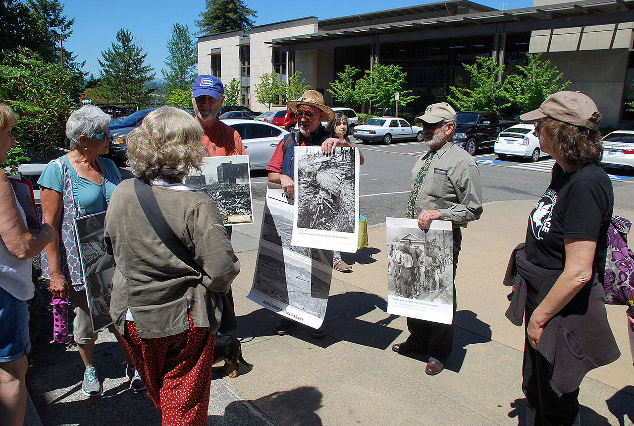 Protestors line up outside the Kitsap County Administration Building and Courthouse before a district court mitigation hearing. Photo: Bob Smith | Kitsap Daily News
