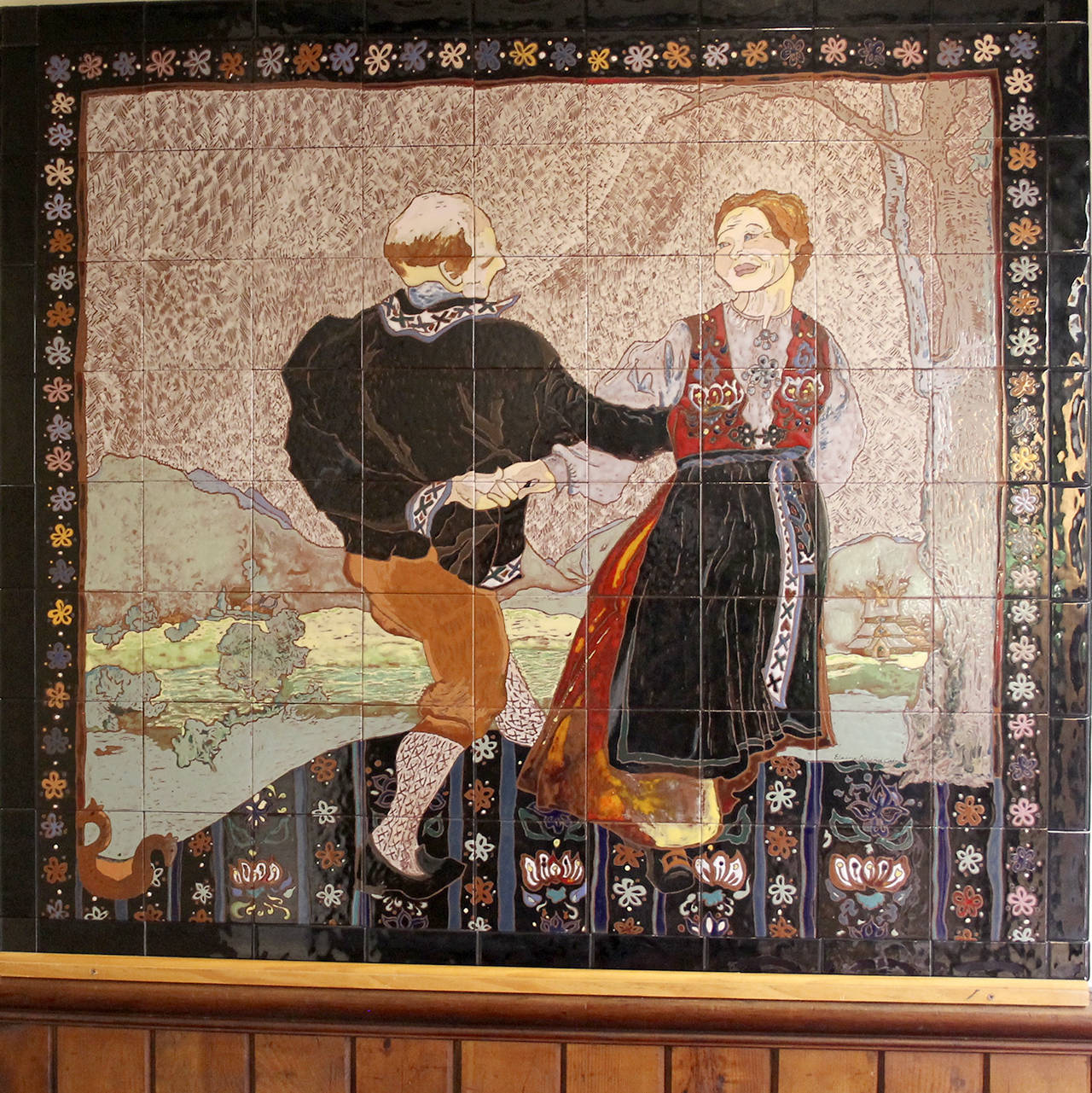 An exquisite tile mural depicting an older couple folk dancing. It, too, once hung in Loretta’s Gift Shop and now will become the property of West Sound Group.                                Terryl Asla/Kitsap News Group