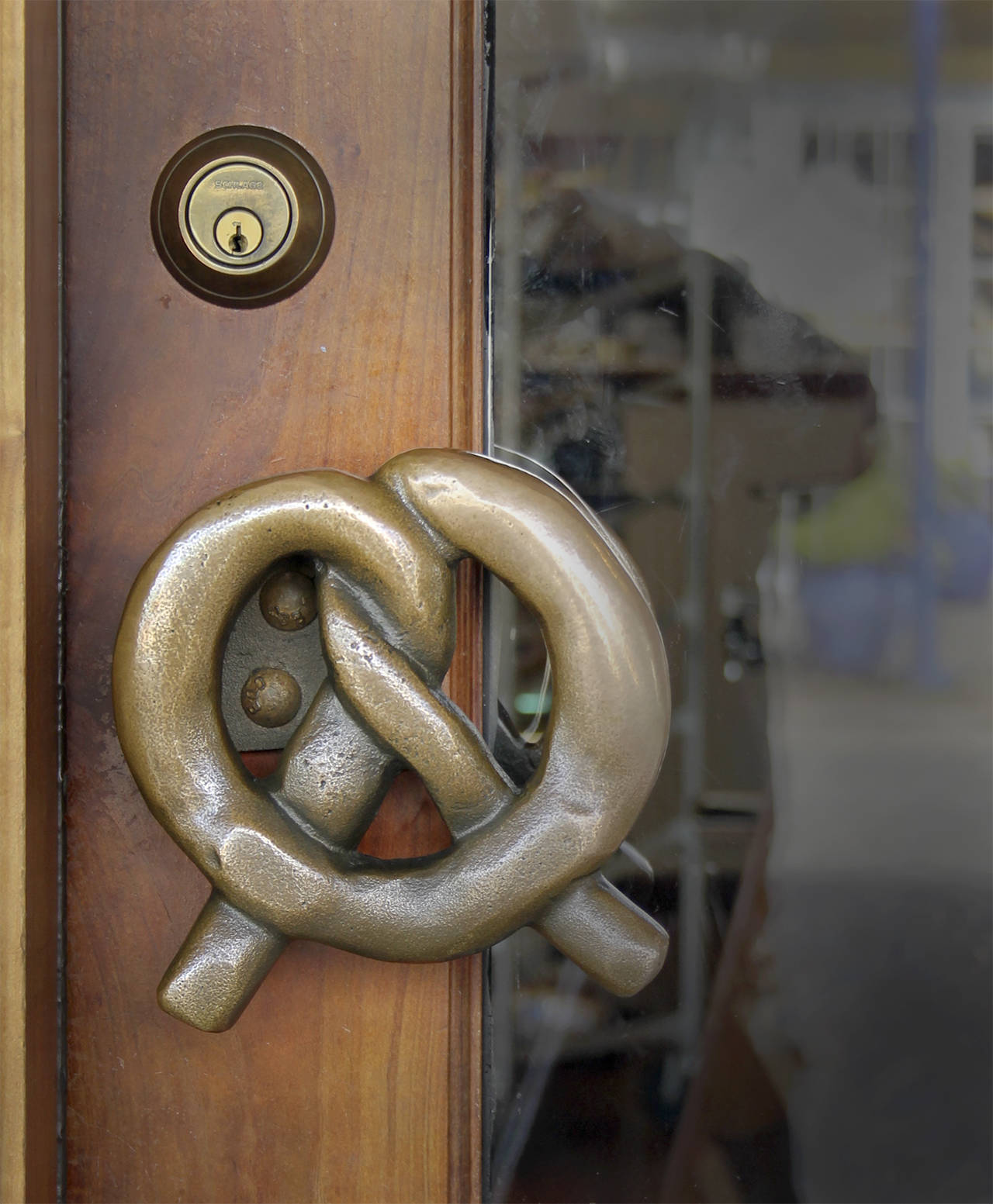 Marion Sluys wanted a bronze pretzel handle for the front door to the bakery. The plan was to have it cast in bronze which meant the foundry needed an original pretzel from which to make a mold. The first attempt to use a real pretzel failed, so the Sluys’ son, Dan, carved one out of wood.                                Terryl Asla/Kitsap News Group