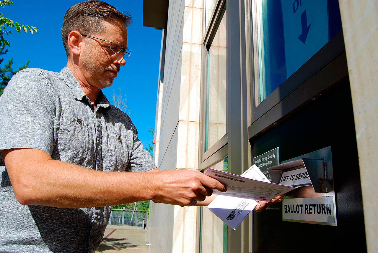 A voters drops off his ballot at the Kitsap County Administration Building, Aug. 1. Ballots most be postmarked today or deposited into a ballot dropbox by 8 p.m. (Bob Smith/Kitsap News Group)